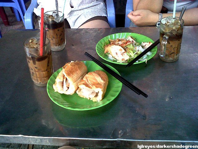 Bahn Mi, iced coffee with milk, and some spicy veggie and meat thing the lady gave us. We can't understand a word she's saying so we don't know what it's called