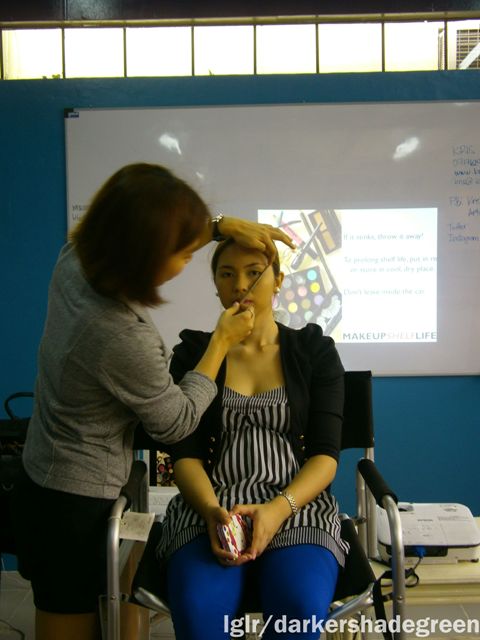 Demonstrating how to shape eyebrows